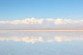Salt Lake Uyuni in Bolivia. off road vehicle over a reflective salt flat ground