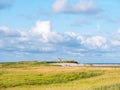 Salt marshes and dunes with sand couch and marram grass in nature reserve Boschplaat on Frisian island Terschelling, Netherlands Royalty Free Stock Photo