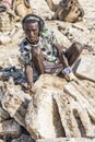 Salt miner working in the salt plains in the Danakil Depression in Ethiopia during winter season.