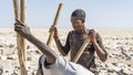 Salt miner working in the salt plains in the Danakil Depression in Ethiopia during winter season.