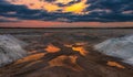 Salt mining on the lake during sunset Royalty Free Stock Photo