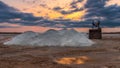 Salt mining on the lake during sunset Royalty Free Stock Photo