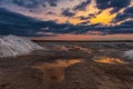 Salt mining on the lake during sunset Royalty Free Stock Photo