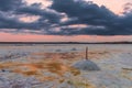 Salt mining on the lake during sunset Royalty Free Stock Photo