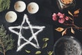 Salt pentagram symbol on wiccan witch altar.