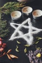 Salt pentagram symbol on wiccan witch altar.