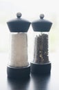 Salt and pepper condiments dispenser Royalty Free Stock Photo