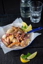 Salt & Pepper Fried Squid Tentacles with fresh lemon Royalty Free Stock Photo