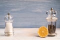 Salt and pepper grinders on a wooden background with an orange Royalty Free Stock Photo