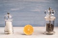 Salt and pepper grinders on a wooden background with an orange Royalty Free Stock Photo
