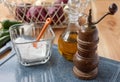 Salt, pepper mill, and olive oil Royalty Free Stock Photo
