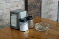 Salt and pepper shaker and ashtray on the table. Royalty Free Stock Photo