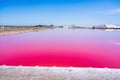 Salt production, pink lagoon and hills in the Mediterranean sea is located in Aigues-Mortes . Camargue, France Royalty Free Stock Photo