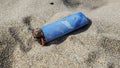 Salt rust Corroded Plastic lighter discarded on sandy sea ecosystem,pollution Royalty Free Stock Photo