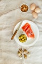 Salt Salmom with quail eggs, nuts and olive on a white linen tablecloth. Top view. Paleo diet. Healthy high protein and low Royalty Free Stock Photo