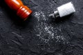 salt and saltcellar on black stone table background top view moc Royalty Free Stock Photo