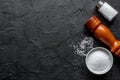 Salt and saltcellar on black stone table background top view mock-up Royalty Free Stock Photo