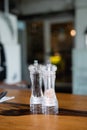 Salt shaker and pepper shaker on the table Royalty Free Stock Photo