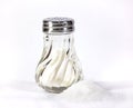 Salt shaker with pile Royalty Free Stock Photo