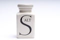 Salt shaker, white with black letter Royalty Free Stock Photo