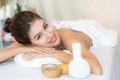 Salt spa massage relaxation concept. Beautiful woman lying down on the bed relax in spa salon with massage Royalty Free Stock Photo