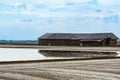 Salt storage granaries, sea salt storage in salt farms. Granary for salt storage and salt farm Solar. Abandoned old wood salt barn