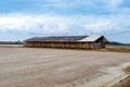 Salt storage granaries, sea salt storage in salt farms. Granary for salt storage and salt farm Solar. Abandoned old wood salt barn