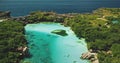 Salt water lake at sea bay with green cliff shore nature of Sumba Island, Indonesia aerial view Royalty Free Stock Photo