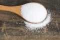 Salt in a Wooden Spoon on a Rustic Background Royalty Free Stock Photo