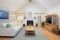 saltbox living room with vaulted ceilings and recessed lighting