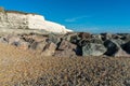 Saltdean beach seafront cliffs with boats in the background at East Sussex Brighton marina, UK