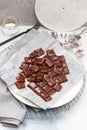 Salted caramel candies cut into square pieces, top view over grey baking paper Royalty Free Stock Photo