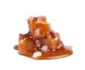 Salted caramel candies and sauce, isolated on white background. Delicious caramel. Royalty Free Stock Photo