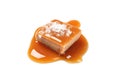 Salted caramel candy with sauce isolated on white Royalty Free Stock Photo