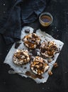 Salted caramel and chocolate meringues over dark Royalty Free Stock Photo