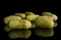 Salted corn puff isolated on black glass