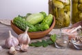 Salted cucumbers. Spices and herbs for making pickles on wooden background Royalty Free Stock Photo