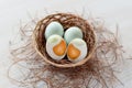 salted duck eggs top view in rattan wicker container set in pine branches