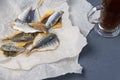 Salted fish lies in unfolded paper