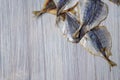 Salted fish lying on a wooden table