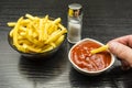 Salted fries eaten with ketchup.