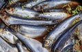 Salted herring with spices in a wooden barrel at a street market