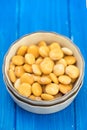 Salted lupins in bowl on wooden background Royalty Free Stock Photo