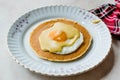 Salted Pancake with Hollandaise Suace, Eggs and Crispy Bacon for Breakfast. Salty Organic Fast Food Royalty Free Stock Photo