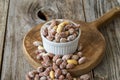 Salted peanuts on wood floor. bulk peanut kernels Royalty Free Stock Photo