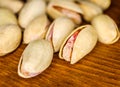 Pistachio nuts lying a lot on wooden background macro image Royalty Free Stock Photo