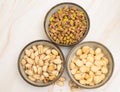 Salted pistachios and macadamia nuts in a bowl Royalty Free Stock Photo