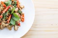 Salted pork with chili & Basil leaves in plate on table Royalty Free Stock Photo