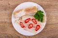 Salted pork lard, pieces of chili pepper, parsley in plate on table. Top view