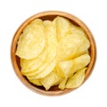 Salted potato chips, crisps, deep fried potato slices in a wooden bowl Royalty Free Stock Photo